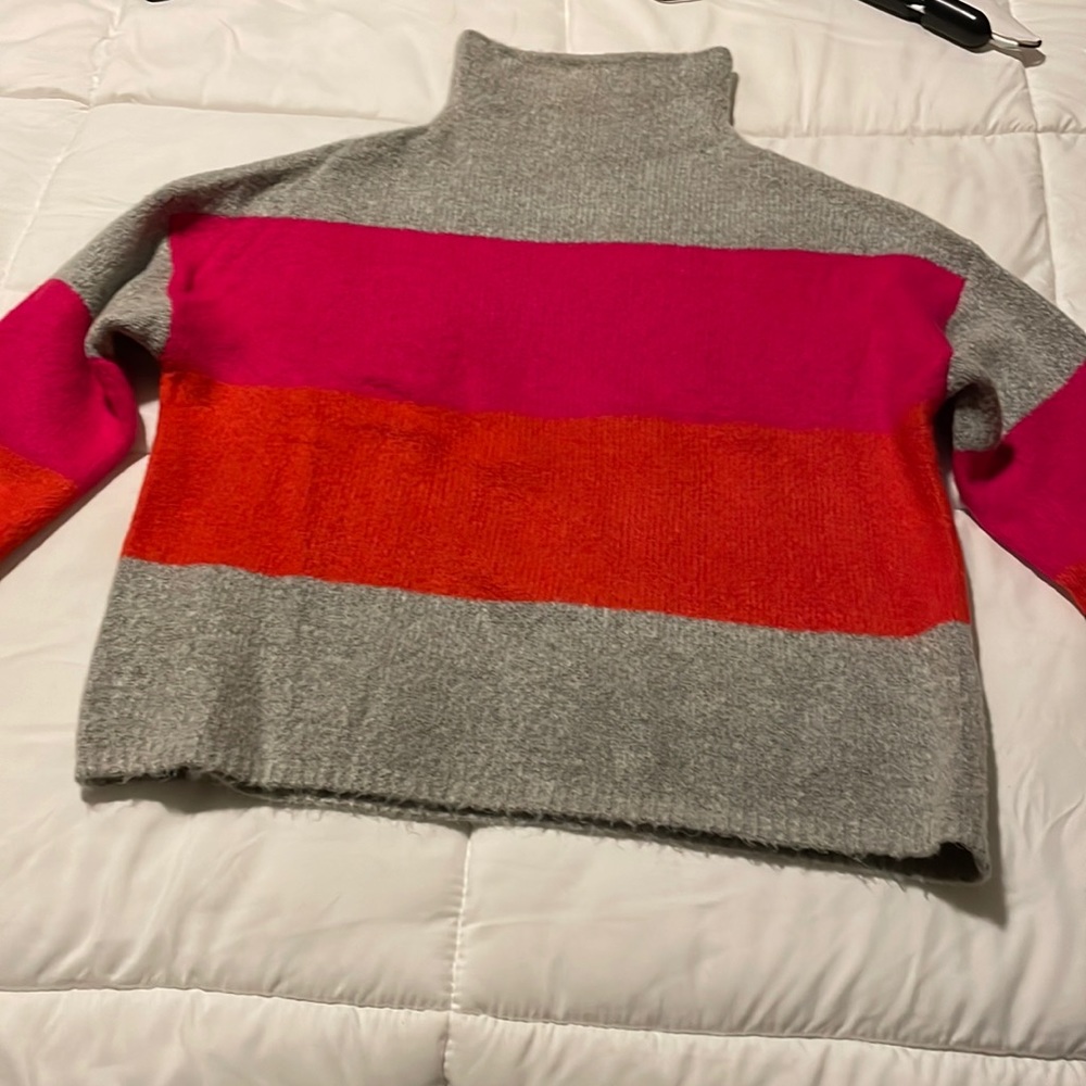 Cliche’ mock turtleneck with bold stripes